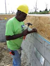 Arthur works on the flooring system on his home