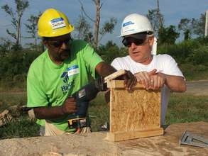 Arthur works alongside a volunteer from Alostar