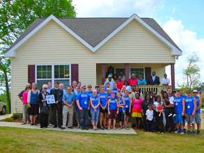 Celebrating her rebuilt home in April 2012.