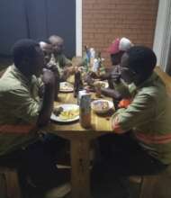 George Dining with Coworkers after Work