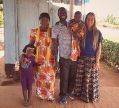 Lucas with his wife, daughters, and Rai