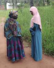 Maimuna Visits with Villager