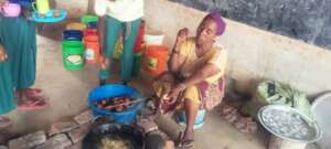 Mama Amina Enjoying Lunch with the Students