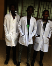 Hamisi (middle) with two classmates