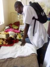 Dibeit visits a child in the pediatric ward