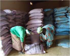 Women receive fertilizer at distribution center