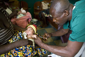 Treating a refugee in Liberia