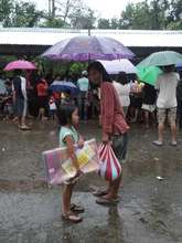 Mother and child with their relief package