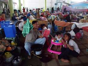 Families receiving their hygiene kits