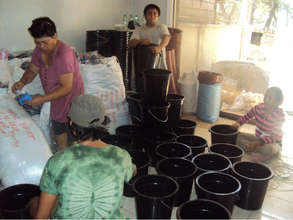 Packing the hygiene kits after storm 'Washi'