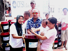 Distributing kits to local families