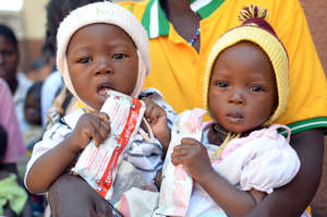 Babies eating Plumpy'Nut in Burkina Faso
