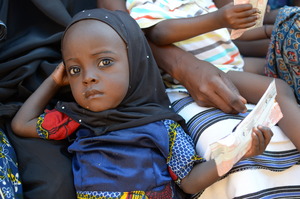 Little girl in Burkina Faso receives Plumpy'Nut