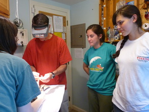 Interns observe Exam in Small Room