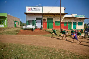 Children running by CFW clinic