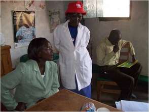 Sarah Njeri (left), w/ CFW community health worker