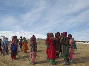 Girls return home after a long day at school.