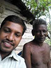 Field Program Manager surveying villager