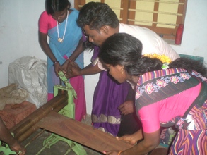 Photo - women building rat catching devices