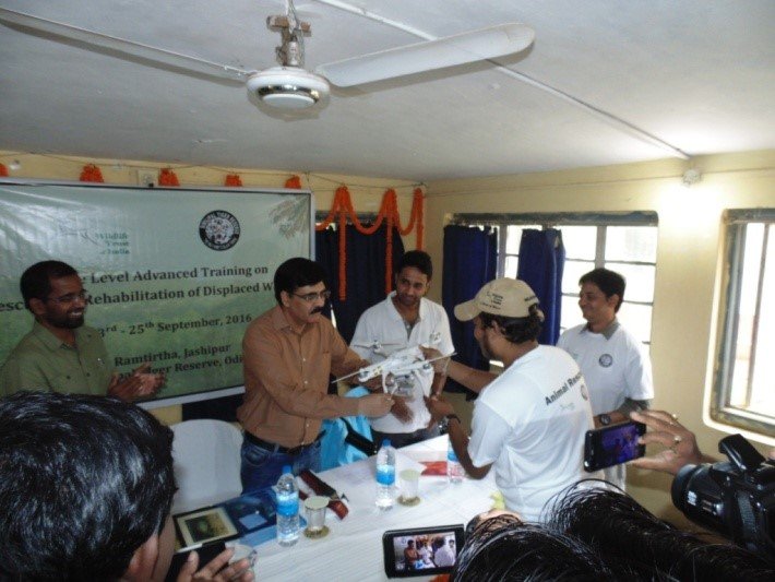 WTI handing over the quadcopter to Field Director.