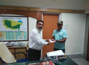 Ex gratia check being handed over