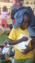 Books and Clothes give away in Kyebando, Kampala