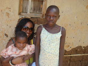 The project manager with two of the orphans