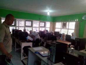 Mr. Rian(tutor) tutoring the students