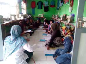 Sewing class students with Miss Ila