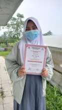 Nadya with her certificate