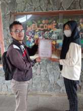 Mr. Cecep hands over certificates to his student
