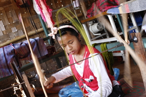 Boarding house girl helping at the weaving centre