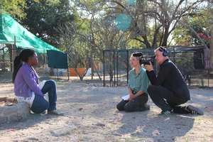 Under the light, with the TV crew