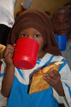 Mary takes tea and mandazi for breakfast