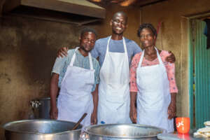 George (centre) and team in the school kitchen.