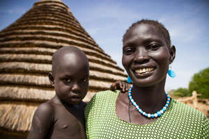 Mary, with her youngest of 8 children.