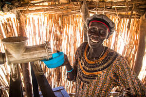 Using a groundnut machine in South Sudan.