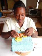Vivian busily fixing sugar flowers on her cake