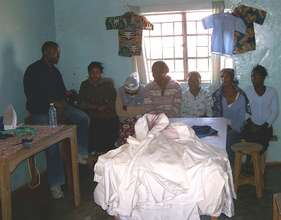 Tailoring students with bee suits they have made