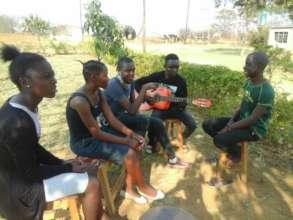 Computer students take a music lesson break