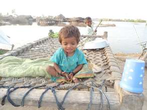 Flood Affected child waiting for help
