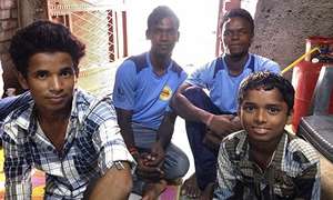Arjun with local youth mentors in Madanpur Khadar
