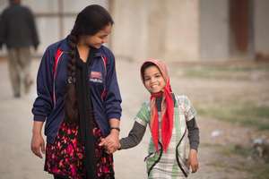 Gulafsha serves as a role model to a young girl