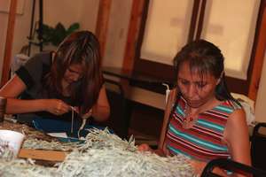 Tamara and Katie preparing the Sage for braids