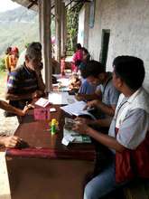 Families wait for aid to build temporary shelter