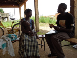 Mother speaking to a village health team worker
