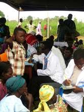 medical health workers attending to people