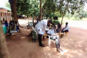 Isaac our medical personel carrying out eye tests