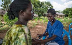 Woman receiving medical care in a medical outreach