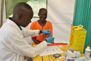 Lab Technitian working on a patient